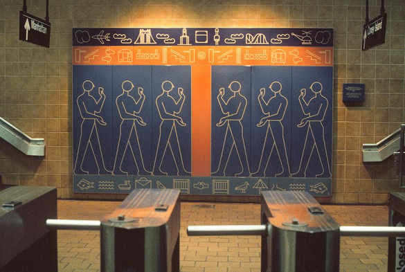 Photograph of the artwork 'Kings Highway Hieroglyphs' (1987) by Rhoda Yohai Andors at the Kings Hwy subway station. The mural features six outlined human figures standing in profile, each with one arm raised. The figures are each set on their own vertical panel with a blue background, and the three on the left face the three on the right, separated by an orange stripe. Above and below the figures are rows of stylized pictograms of things like clouds, an airplane, a bridge, a roller coaster, a helicopter, fish, and birds, modern visual symbols echoing ancient hieroglyphs. A plaque with more information about the artwork is visible but illegible. Subway turnstiles are visible in the foreground, with directional signs for 'Manhattan' and 'Coney Island' hanging above. Photo by Rhoda Yohai Andors via MTA Arts & Design at https://www.mta.info/agency/arts-design/collection/Kings-Highway-Hieroglyphs.