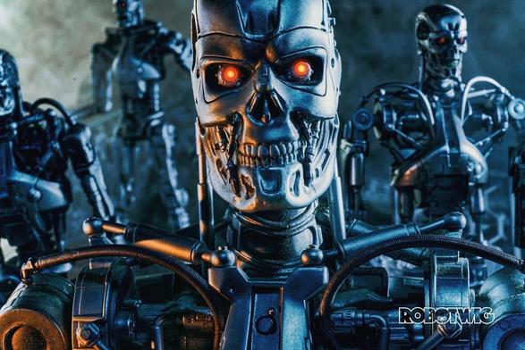 Endoskeletons looks directly at the camera other endos March in the background through smoke and rubble