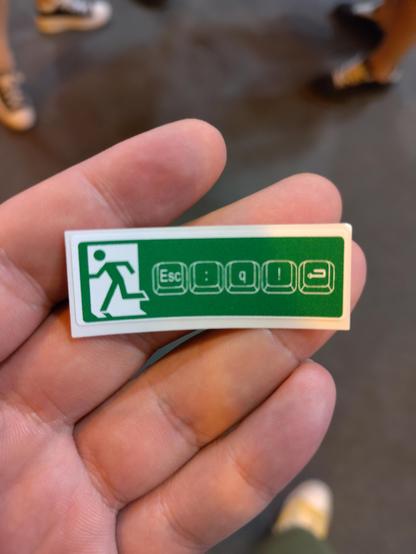 Green exit sign with: ESC : q ! Enter