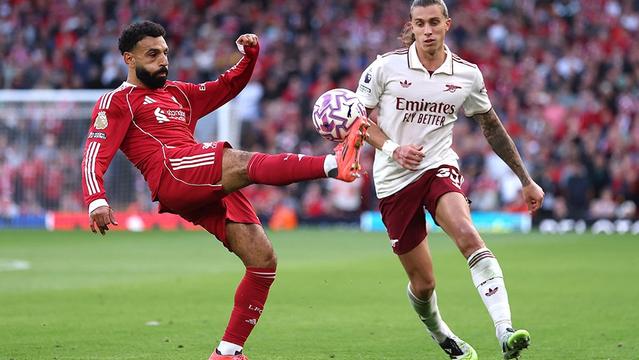 LIVERPOOL, ENGLAND - AUGUST 31: Mohamed Salah of Liverpool is tackled by Riccardo Calafiori of Arsenal  during the Premier League match between Liverpool and Arsenal at Anfield on August 31, 2025 in Liverpool, England. (Photo by Alex Pantling/Getty Images)