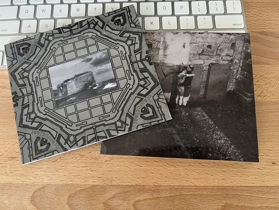 A photo of two CDs, “Kolik-San-Art” (1986) and “A Con Cristal” EP (1987) with “Rats Can Coil Cats Can Roil” 12-inch single (1990). These albums, long out of print, have been remastered and reissued by the Silentes label in Italy.