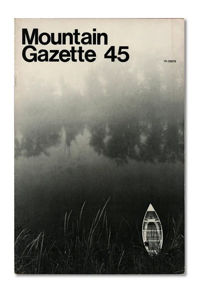 Issue 45 features a serene black-and-white photo of a lake drowned in fog with a canoe at its bank.