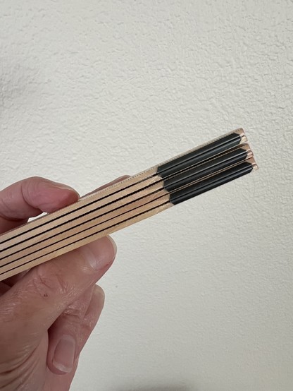 A color photo of said folding ruler from its side where you can see the steel joints. It has a very satisfying snap when folding or unfolding and is quite sturdy!