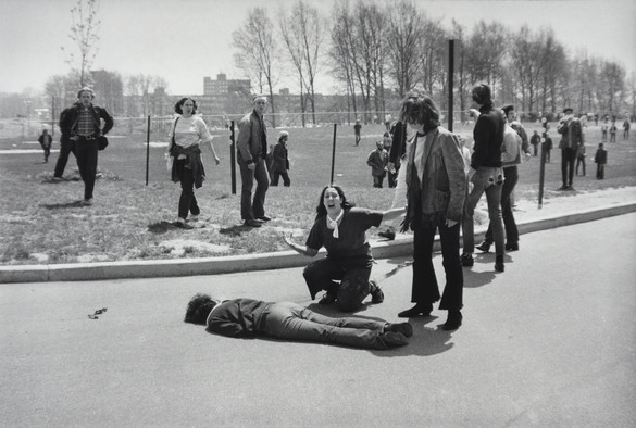 A black-and-white photo of Mary Ann Vecchio screaming as she kneels over the body of Jeffrey Miller during an anti-war demonstration at Kent State University, Ohio, May 4, 1970. 📸 by John Filo.