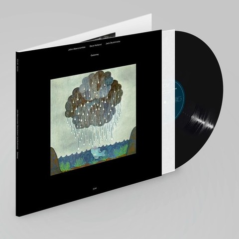 A color photo of the album cover for “Gateway” features a painting of brownish clouds evacuating rain down over a river with vegetation and a blue fish with its mouth open and an excited expression.