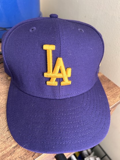 Classic “LA” logo dodgers hat. In purple and gold.