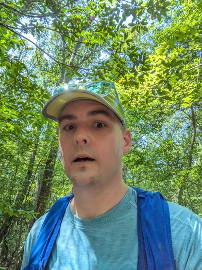 Selfie of me running when I realized I was timing out of the race. Under tree canopy.
