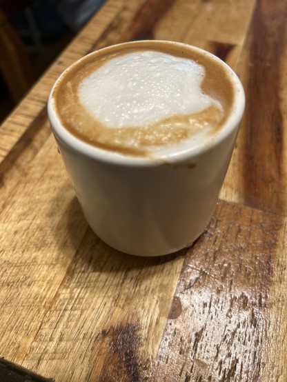Cortado style coffee with a small bit of foam on top.