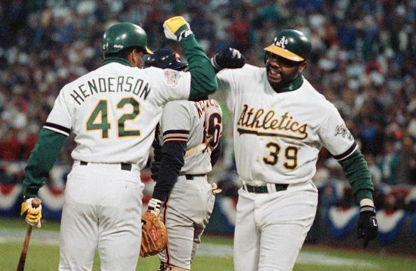 A photo of Dave Parker (39) arm bumping Rickey Henderson (42) during baseball’s 1989 World Series, also known as the “Bay Bridge Series” against the San Francisco Giants.