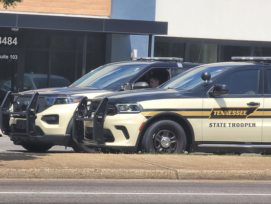 State troopers from the Tennessee Highway Patrol (THP) observe protestors at Poplar and Highland, Memphis, Tennessee, July 4th 2025. Photo via tlyns-boyfriend @ bluesky.
