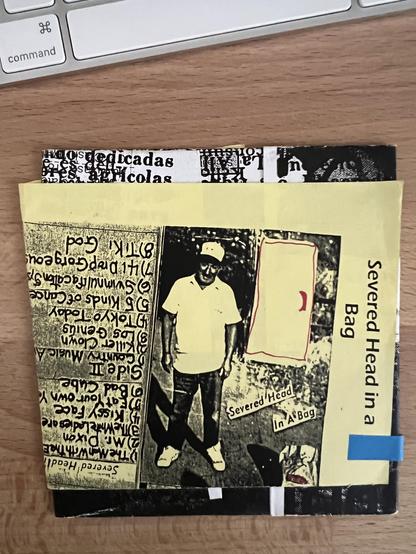 Unofficial CDr version of this 1983 cassette sports a photo of some rando standing outside in front of a refrigerator and wearing a trucker hat.