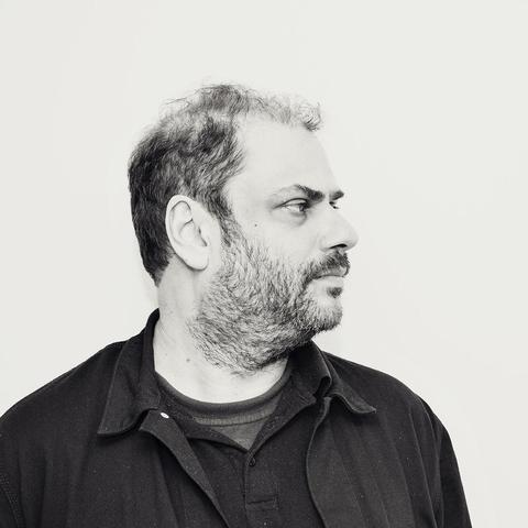 Black-and-white photo of Twitch with his customary ten-day beard.