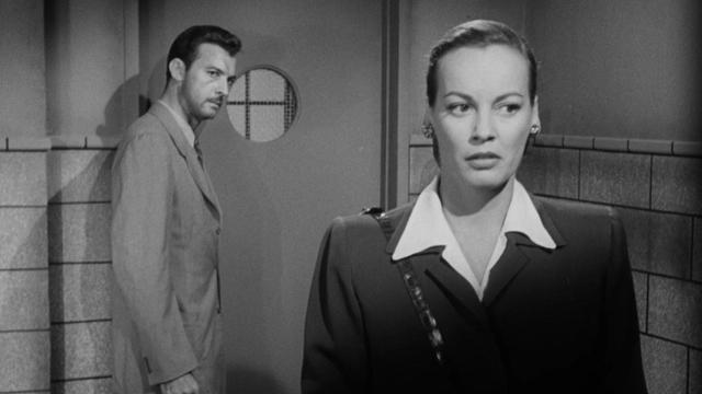 Max Thursday and his ex-wife (Faye Emerson) in the police station.