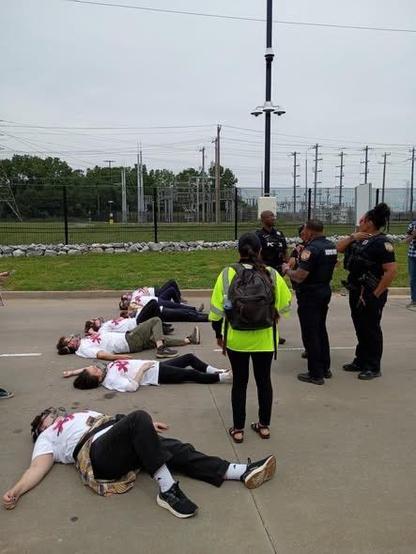 Protestors lie in the street outside xAI in Memphis, Tennessee 