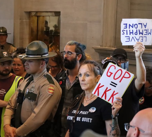 Protestors inside the Tennessee state capitol in Nashville; Thursday, May 7th, 2026. The Republican-supermajority legislature voted to split Memphis’s congressional seat, long held by Democrats, among three safe Republicans districts. Memphis, particularly Black Memphis, lost its representation.

One protestor has a sign that says “GOP = KKK.” My dumb ass is there holding a “Leave Memphis Alone” sign upside down 🙃 