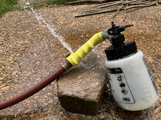 A Chapin G362D hose end sprayer. It’s attached to a hose that’s turned on and water is spewing out of two holes that appear to be overflow valves. If I remove the tank, this still happens and also water shoots out of the nozzle. The handle is not depressed and the red knob is extended all the way out, so it’s not holding the valve open.