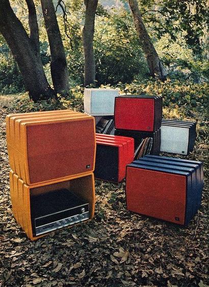 Buncha guitar amps arranged artfully in a forest, as one does.