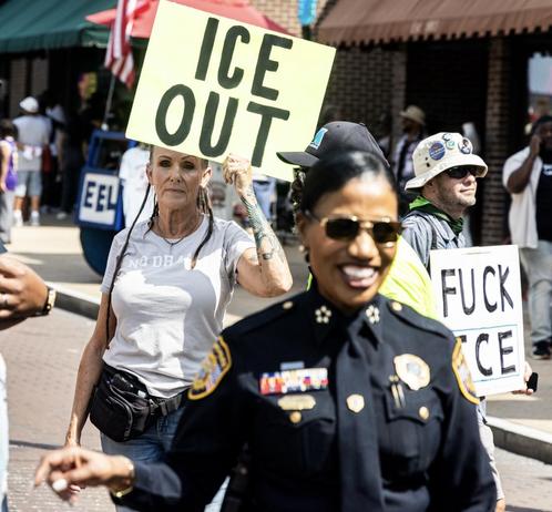 Memphis Police Chief CJ Davis appears on Beale Street for Memphis’s 901 Day festivities, August 29th, 2026. She’s beaming with a big smile. Behind her, protestors hold signs that say “ICE OUT” and “FUCK ICE.” That’s me with the second one.