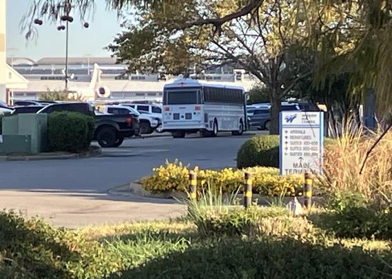 A prisoner transport bus with high-security windows is visible in the parking lot of Wilson Air in Memphis. The bus came from a nearby ICE CoreCivic facility in Mason, Tennessee. It’s full of kidnapped immigrants about to be sent to a concentration camp in Louisiana. 