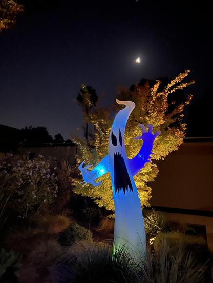 It has BEGUN. Bofore you stands a cartoonishly shaped ghost with ghoulish mouth and angry black eyes sprouting up from sage grass with disco lighting and a partial moon in the distance.